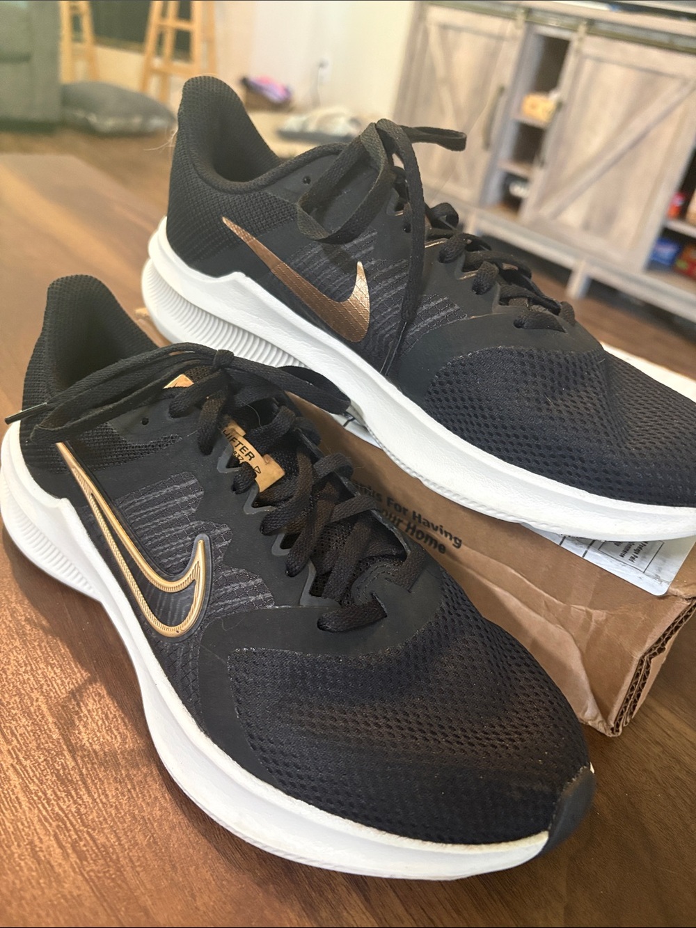 Nike Women’s 8.5 Black Athletic Shoes with White Midsole and Gold Swoosh